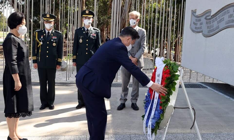 South Korean President Moon Jae-in places a wreath in front of a monument to honor Australia's participation in the Korean War in Canberra on Dec. 13, 2021