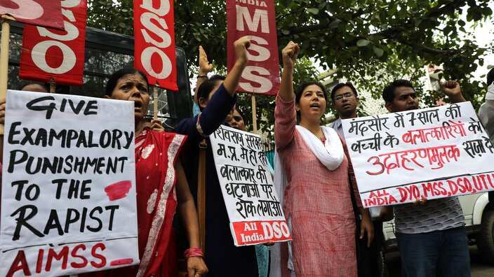 Indian activists hold placards as they protest against the alleged rape of a seven years old girl in Mandsaur 