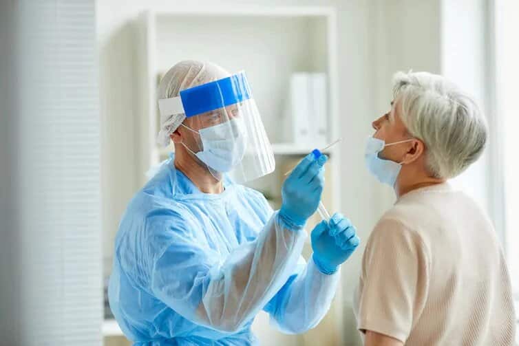 A person undertakes the conventional PCR test for COVID-19.