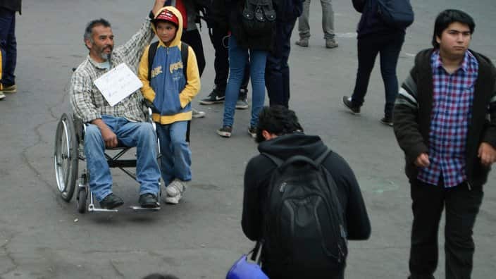Refugee on wheelchair