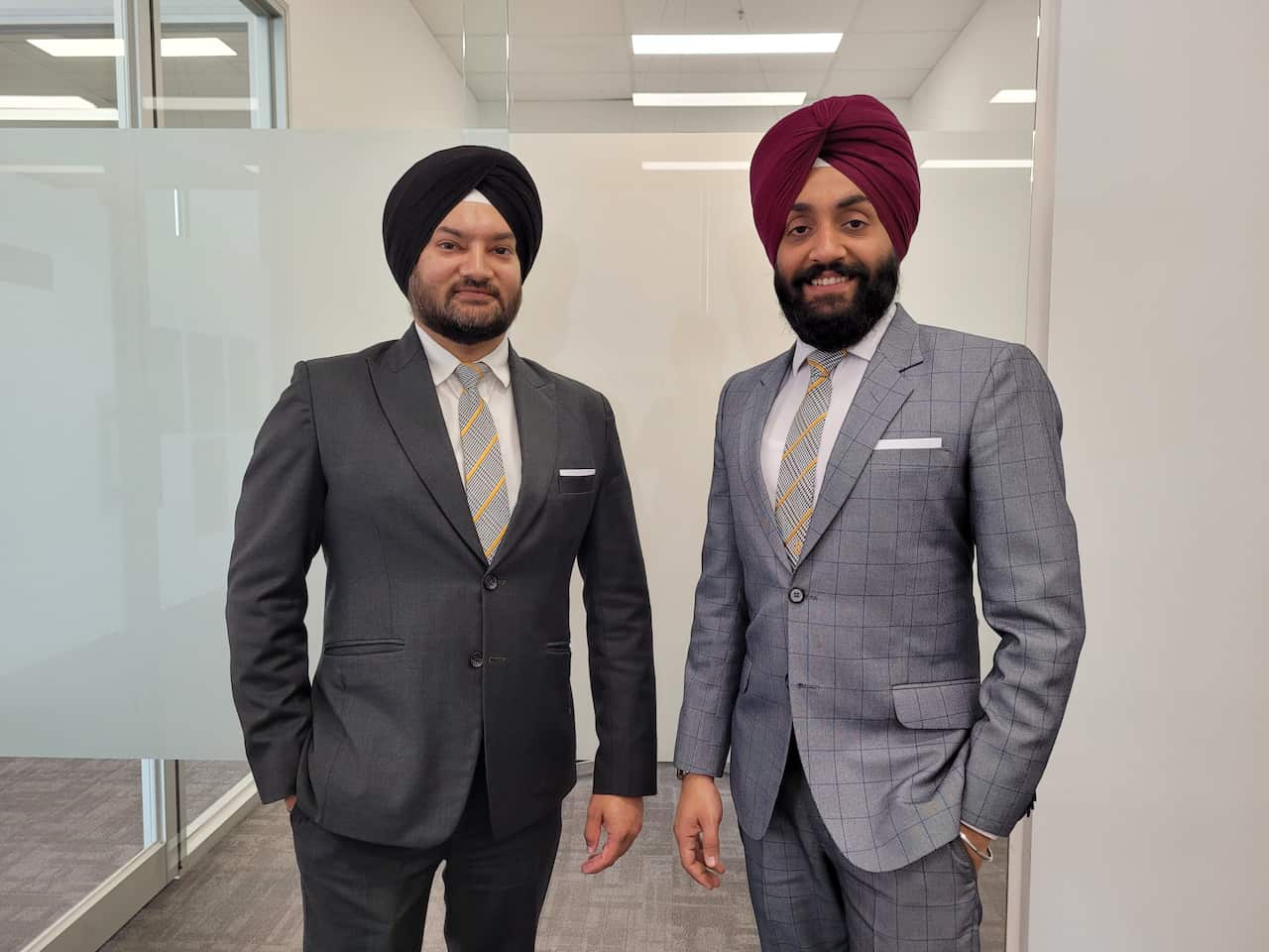 Terry Singh (R) and Jas Bhandari of Raine & Horne real estate in Craigieburn, Melbourne