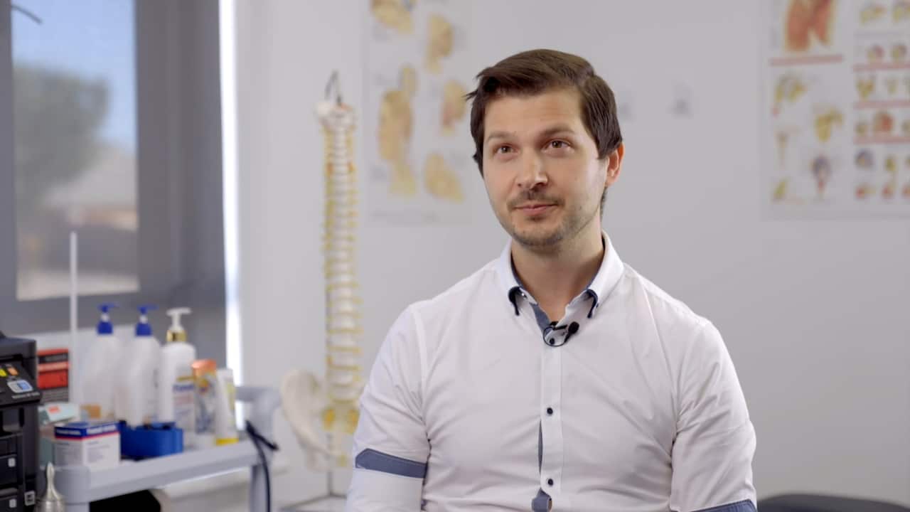 Robert Salerno sitting in his studio.