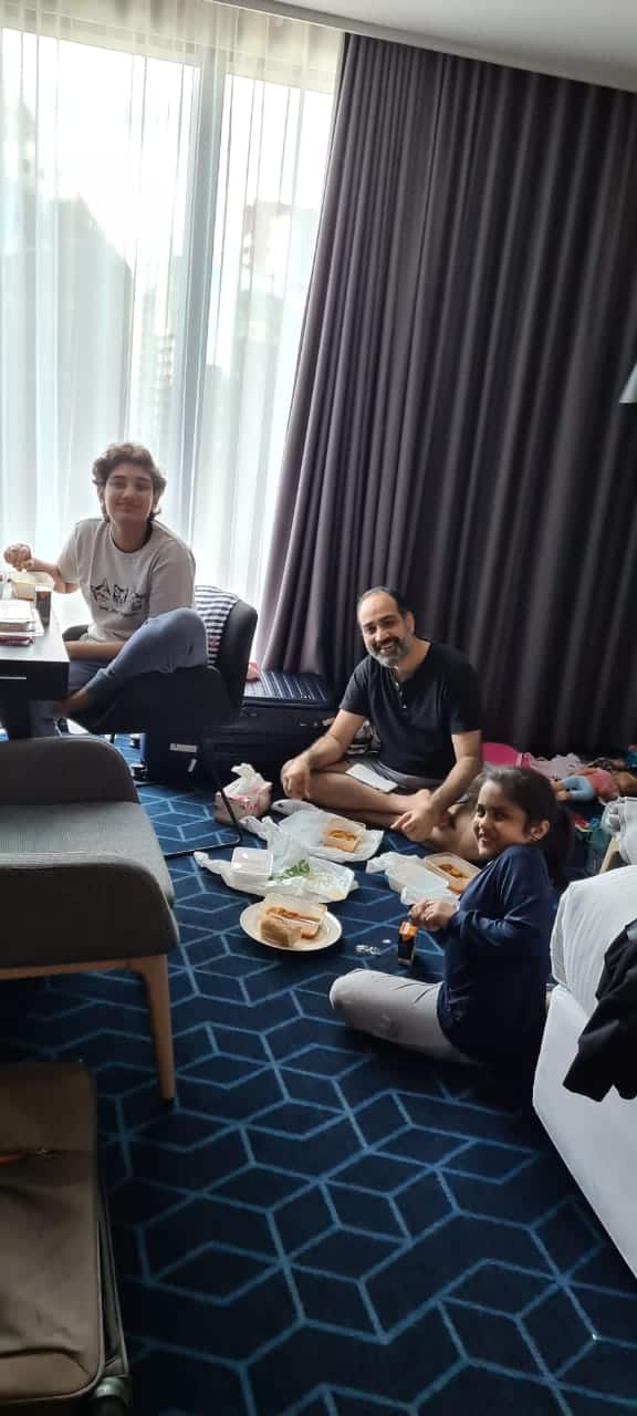 The Saboo family enjoying a picnic in hotel quarantine in Melbourne.