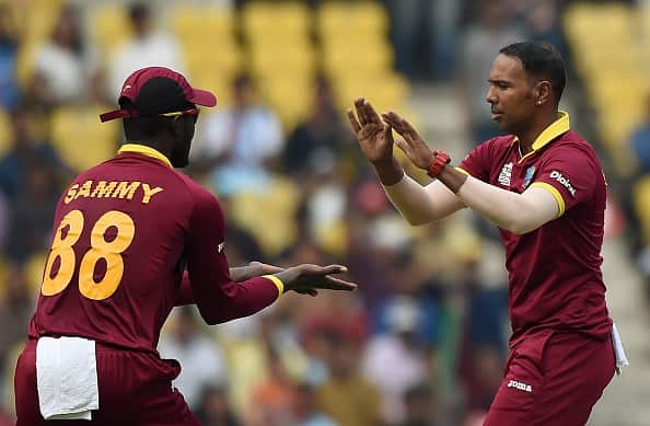 West Indies bowler celebrates after taking the wicket of unseen Afghanistan batsman Usman Ghani  PUNIT PARANJPE/AFP/Getty Images