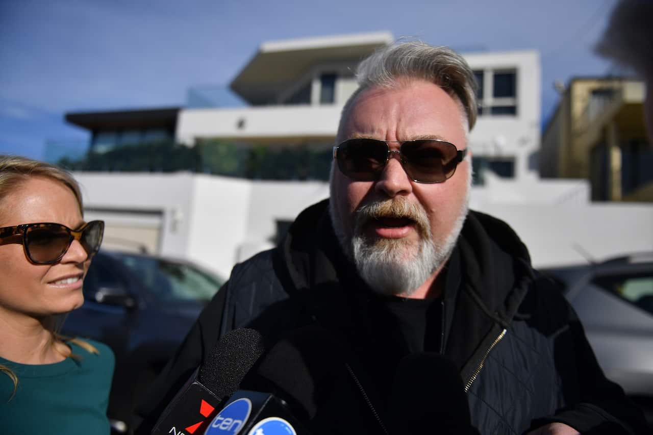 Radio host Kyle Sandilands arrives at the house of Kings Cross nightclub owner John Ibrahim during a police operation at Dover Heights in Sydney, Tuesday, July 31, 2018. (AAP Image/Mick Tsikas) NO ARCHIVING