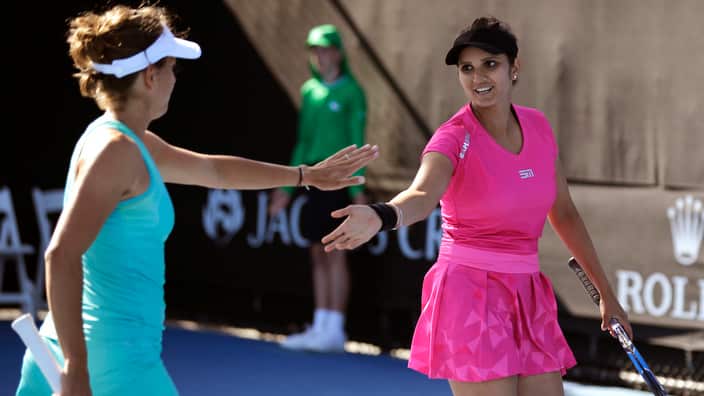 Indias Sania Mirza, and partner Barbora Strycova of the Czech Republic celebrate during their first round women's doubles match at the Australian Open 2017