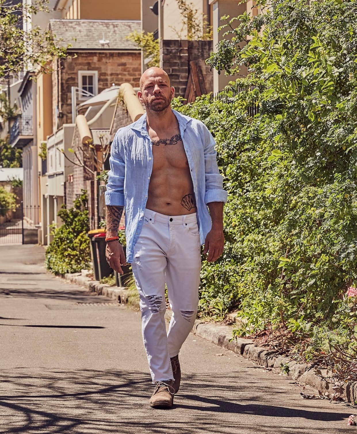 Santo Dragone shows off his abs.