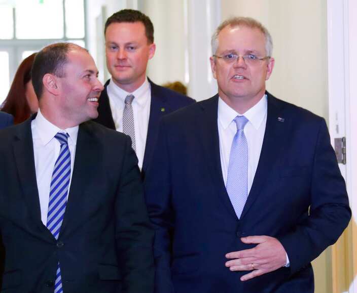Incoming Australian Prime Minister Scott Morrison (R) walks next to his new deputy Josh Frydenberg