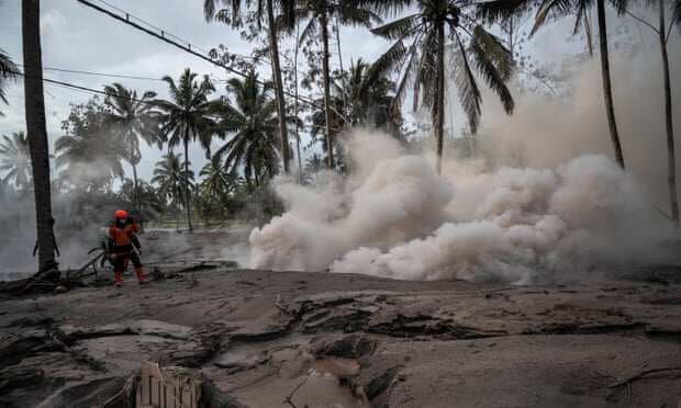 Volcanic ash envelops village of Sumber Wuluh.