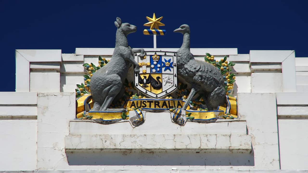 Commonwealth of Australia coat of arms above the entrance to Old Parliament House, Parkes, Canberra, Australian Capital Territory, Australia. 