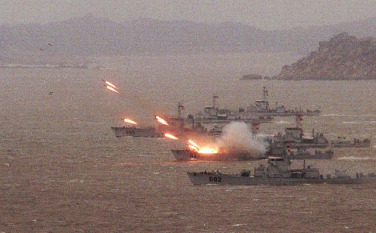 Picture from March 25, 1996, showing warships launching missiles to clear a beach head during a mock attack on Taiwan.