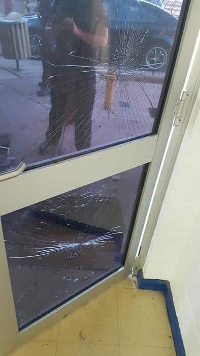 Smashed glass door at the Gurudwara