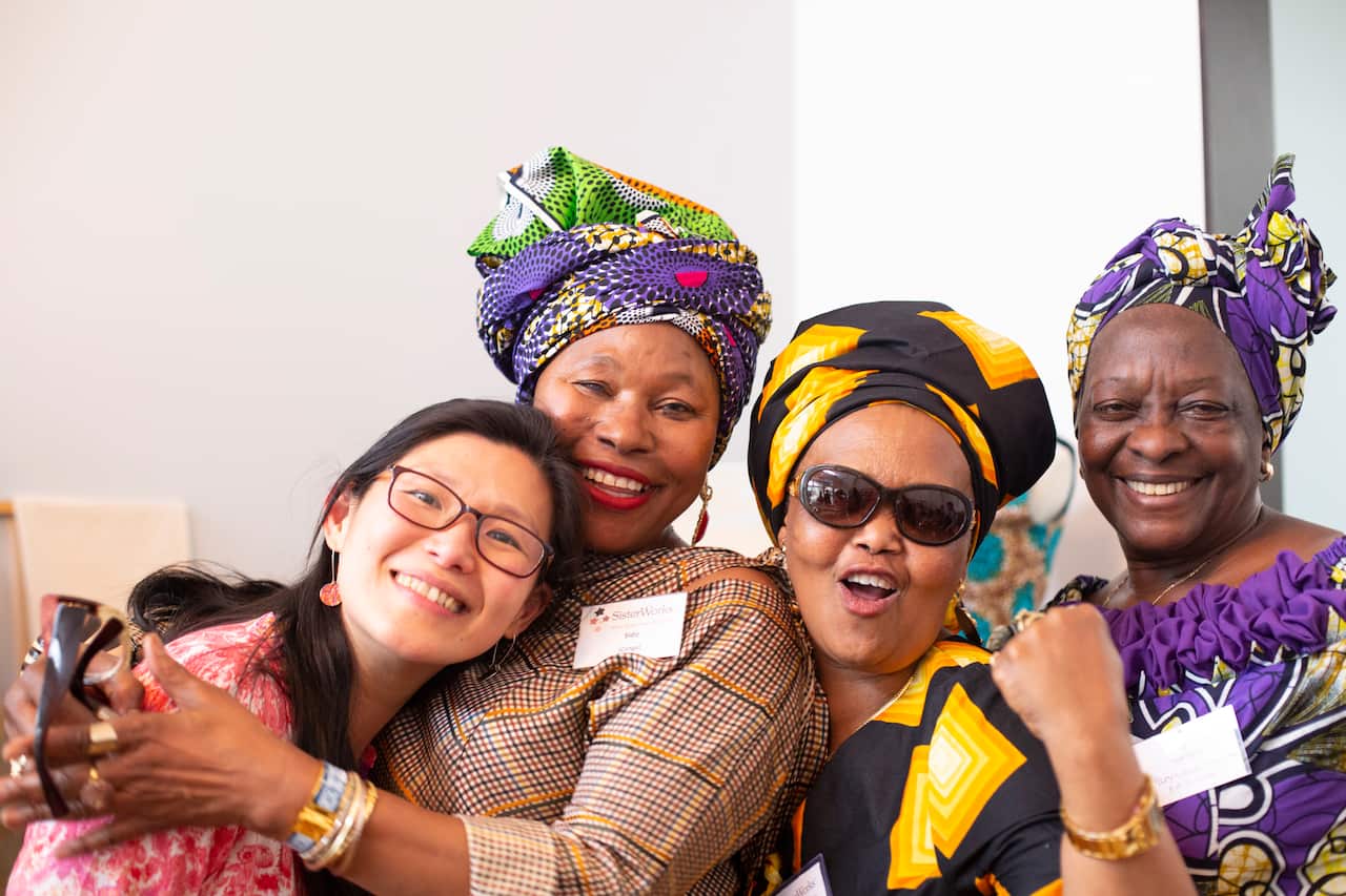 Ifrin Ficktock (left) with some members of Sister Works after the launch of SCE program at Richmond Townhall, 21 Nov 2019. 