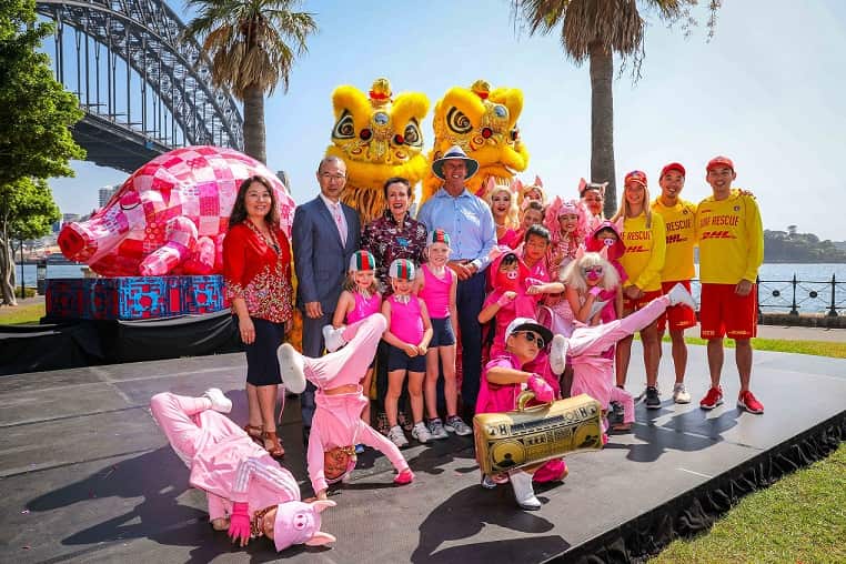 Group photograph with Lord Mayor Clover Moore, Councillor Robert Kok, Surf Life Saving NSW CEO Steven Pearce, Sydney Lunar Festival Curator Valerie Khoo and Dancekool roving pigs dancers.