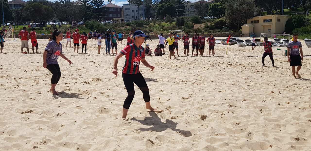 Police playing beach soccer