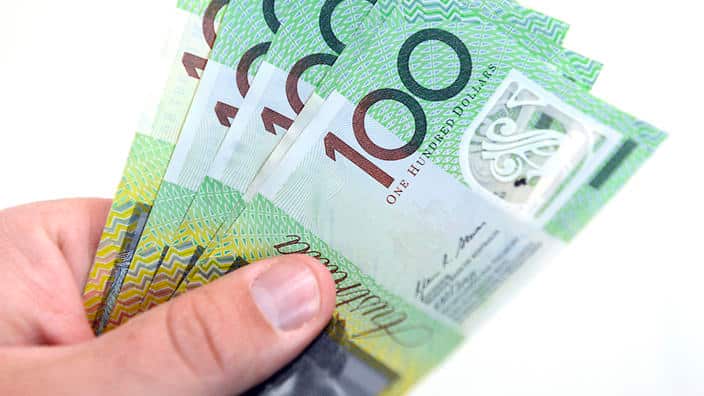 $100 Australian dollar notes, pictured in Brisbane, Tuesday, Aug. 20, 2013. (AAP Image/Dan Peled) NO ARCHIVING