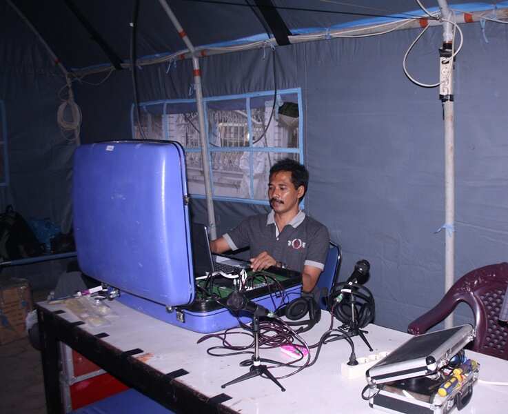 Sukiman Mochtar Pratomo in an emergency broadcasting at Sinabung Mountain in the Karo plateau of Karo Regency, North Sumatra, Indonesia, 2019.