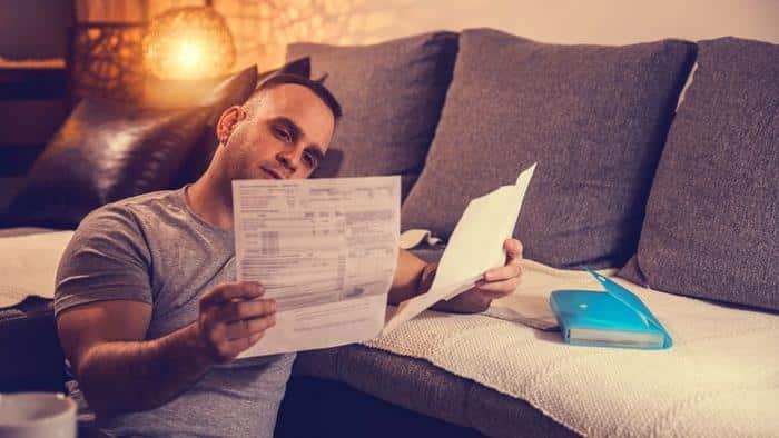 Young man dealing with home finances