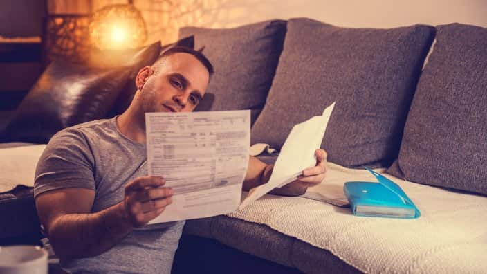 Young man dealing with home finances
