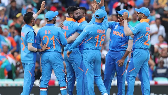 Indian players celebrate the dismissal of New Zealand's Martin Guptill during the Cricket World Cup warm up match between India and New Zealand at The Oval in London, Saturday, May 25, 2019. (AP Photo/Aijaz Rahi)