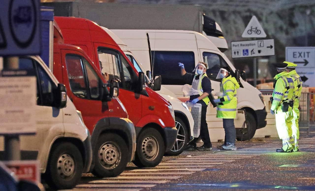 Testers prepare to take samples from drivers parked in the Port of Dover in Kent