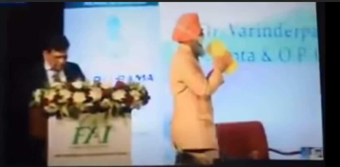 Dr Varinderpal Singh, Principal Soil Scientist at PAU going on stage to register his sentiments with the Minister and dignitaries on refusing the award