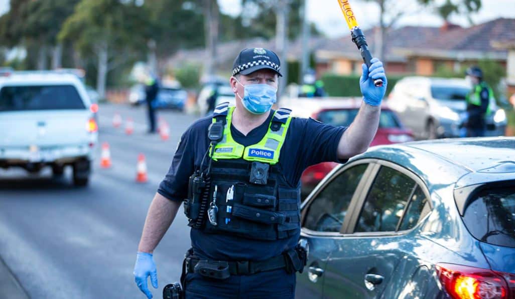 Victoria records 77 new coronavirus cases as police enforce lockdown covering 300,000 people
