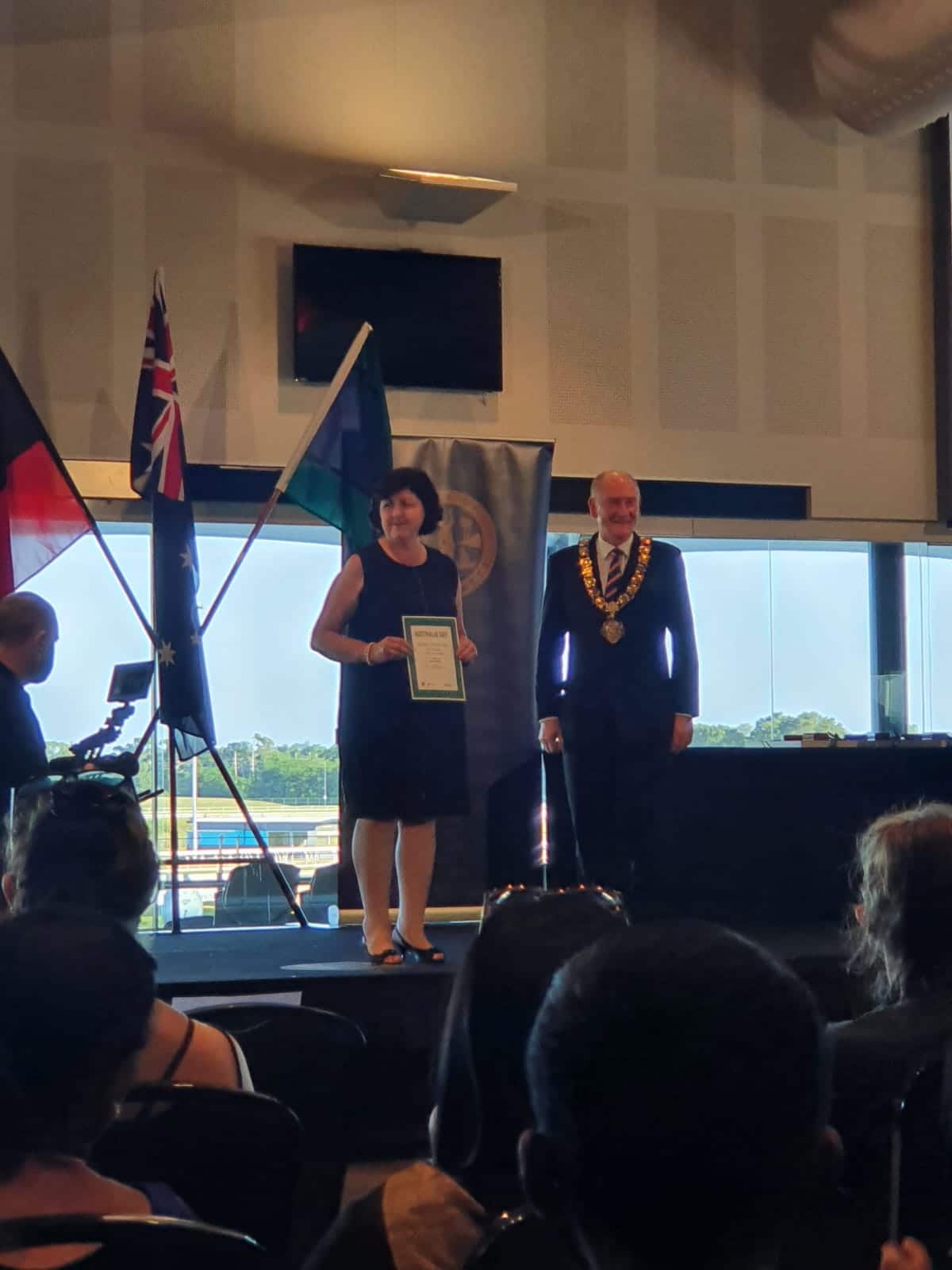 Yvonne Bacha on stage with Mayor of Paramatta Bob Dwyer, receiving the honour of Citizen of the Year.