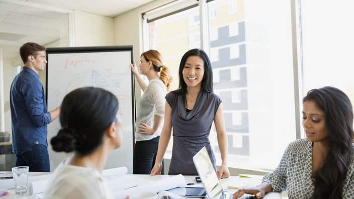 Business colleagues working on project in office