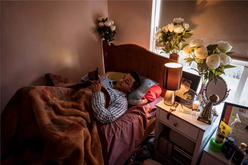 Yunus in his bedroom in Melbourne