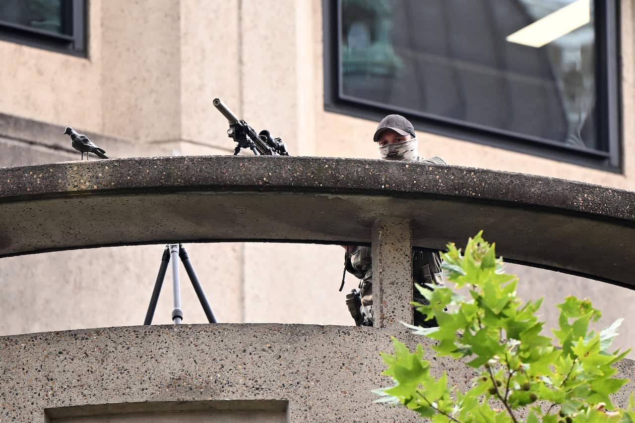 A sniper in military fatigues in Sydney's CBD. 