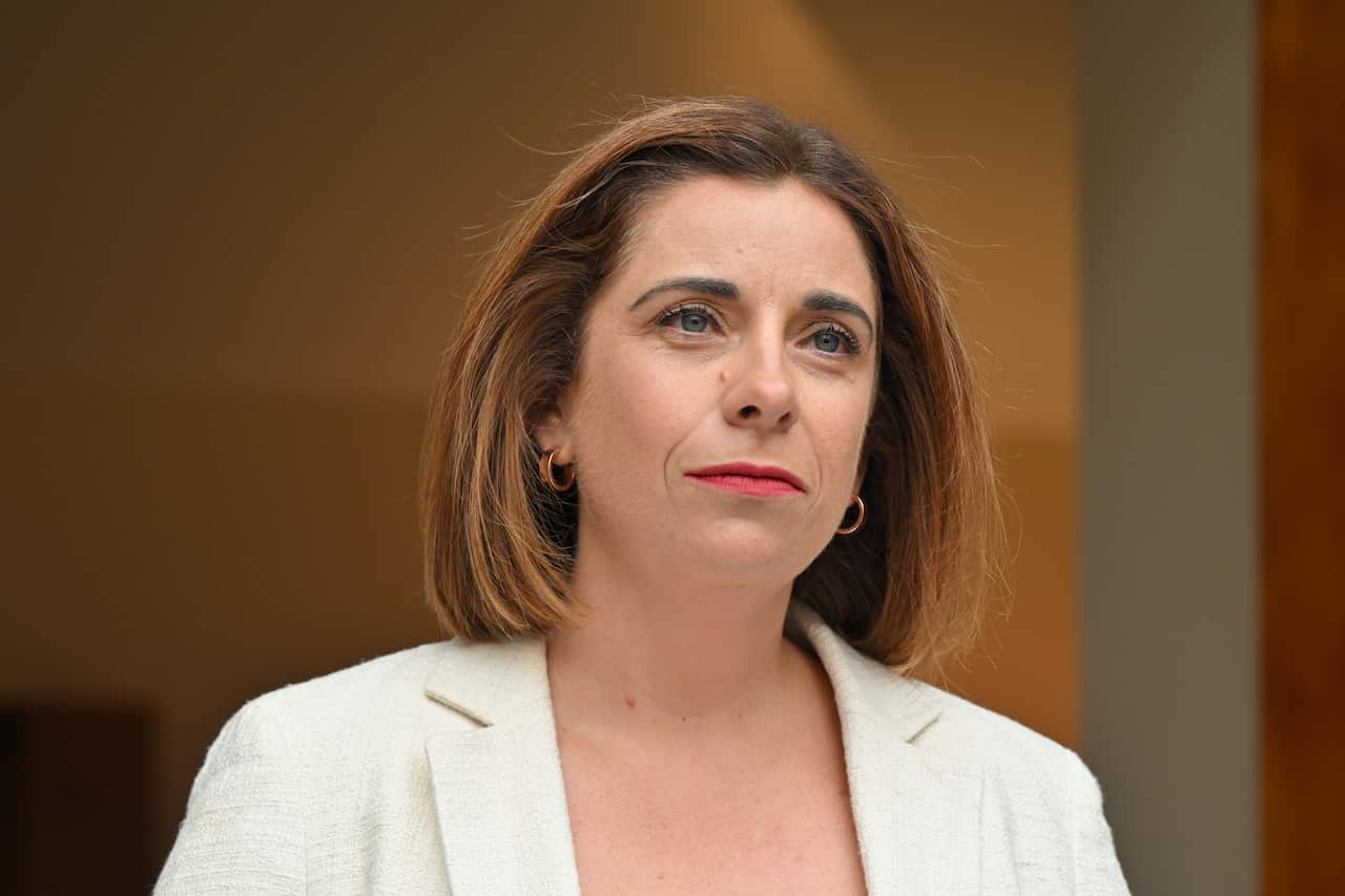A woman in a white jacket