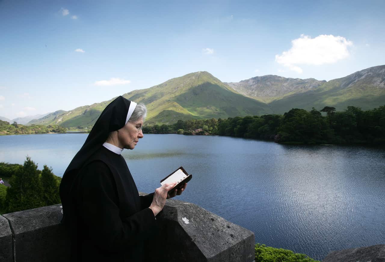 6.1 Sr Genevieve Reading on Castle Terrace at Kylemore Abbey.jpg