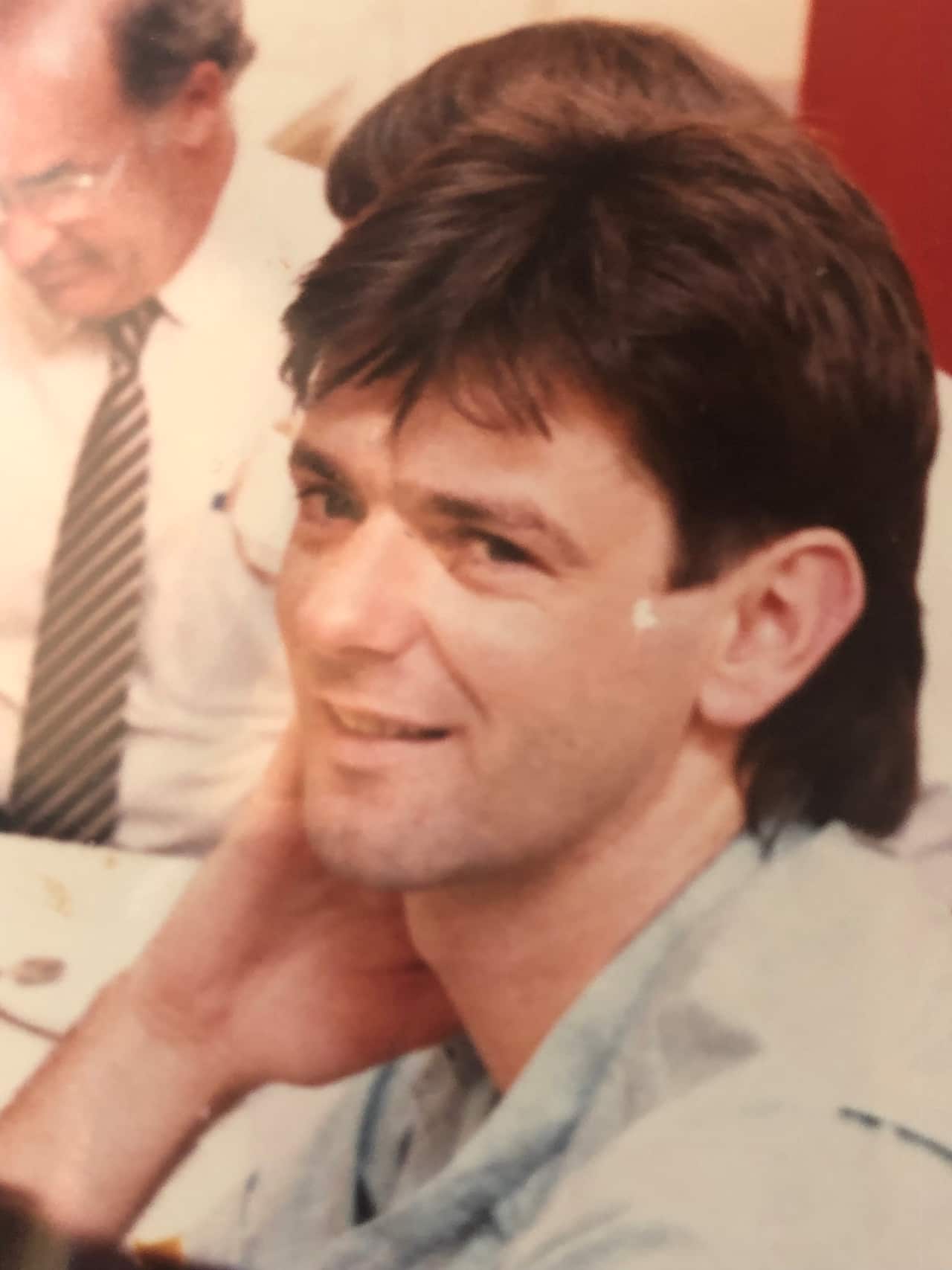 A man sitting down at a table