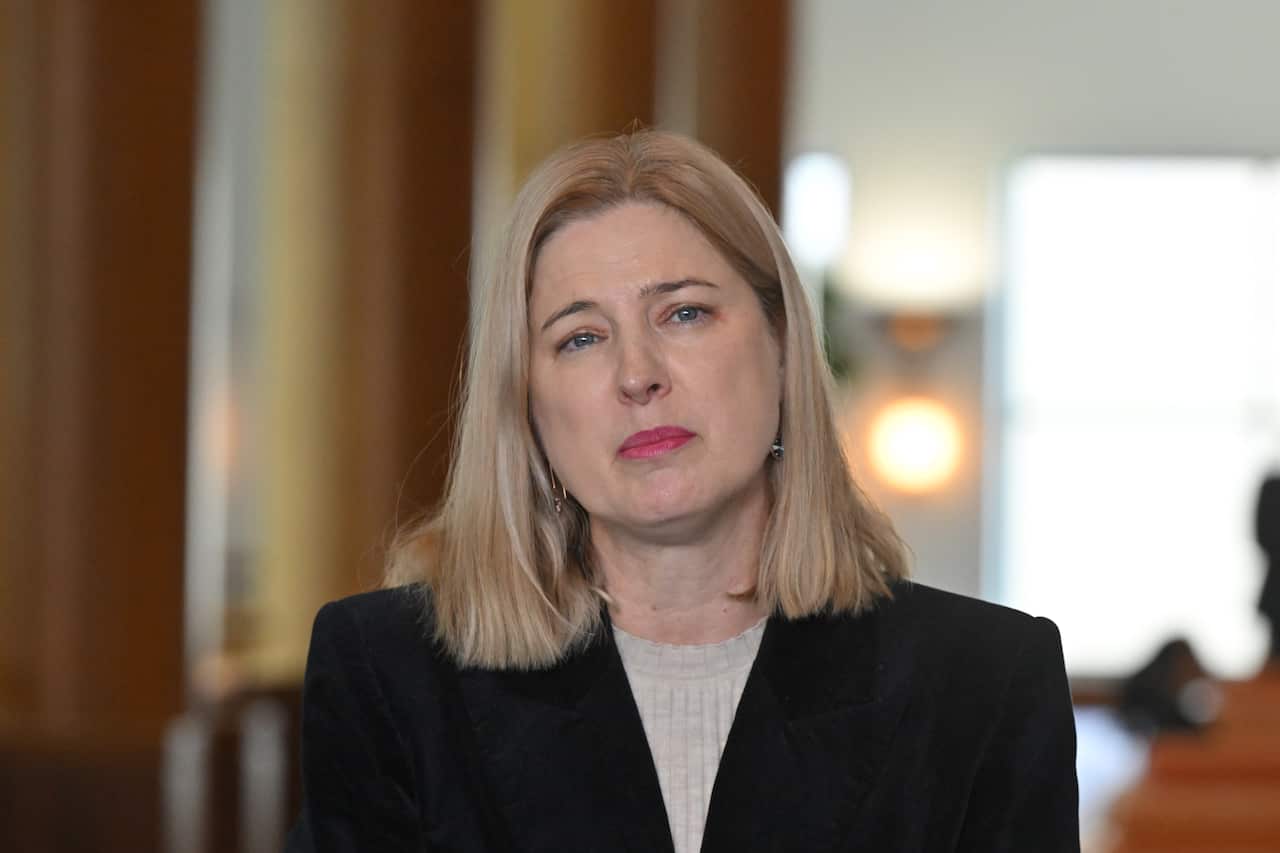 A woman listening during the press conference.