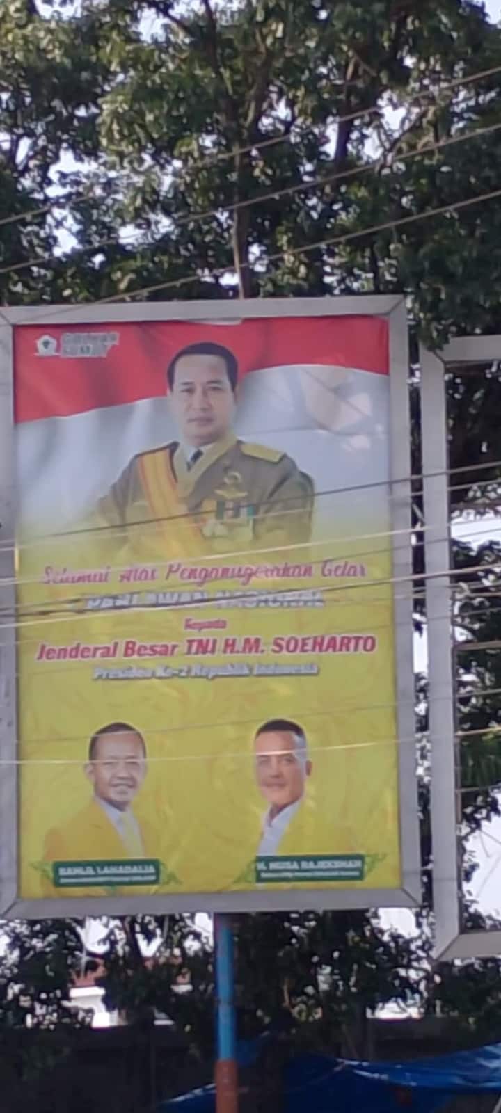 A poster featuring a man in a military uniform at the top, with two other politicians at the bottom.