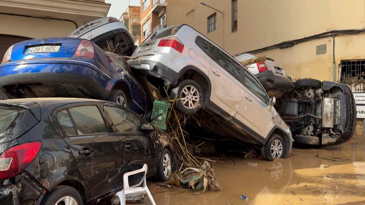 Cars collapsed on top of one another in Valencia, Spain.