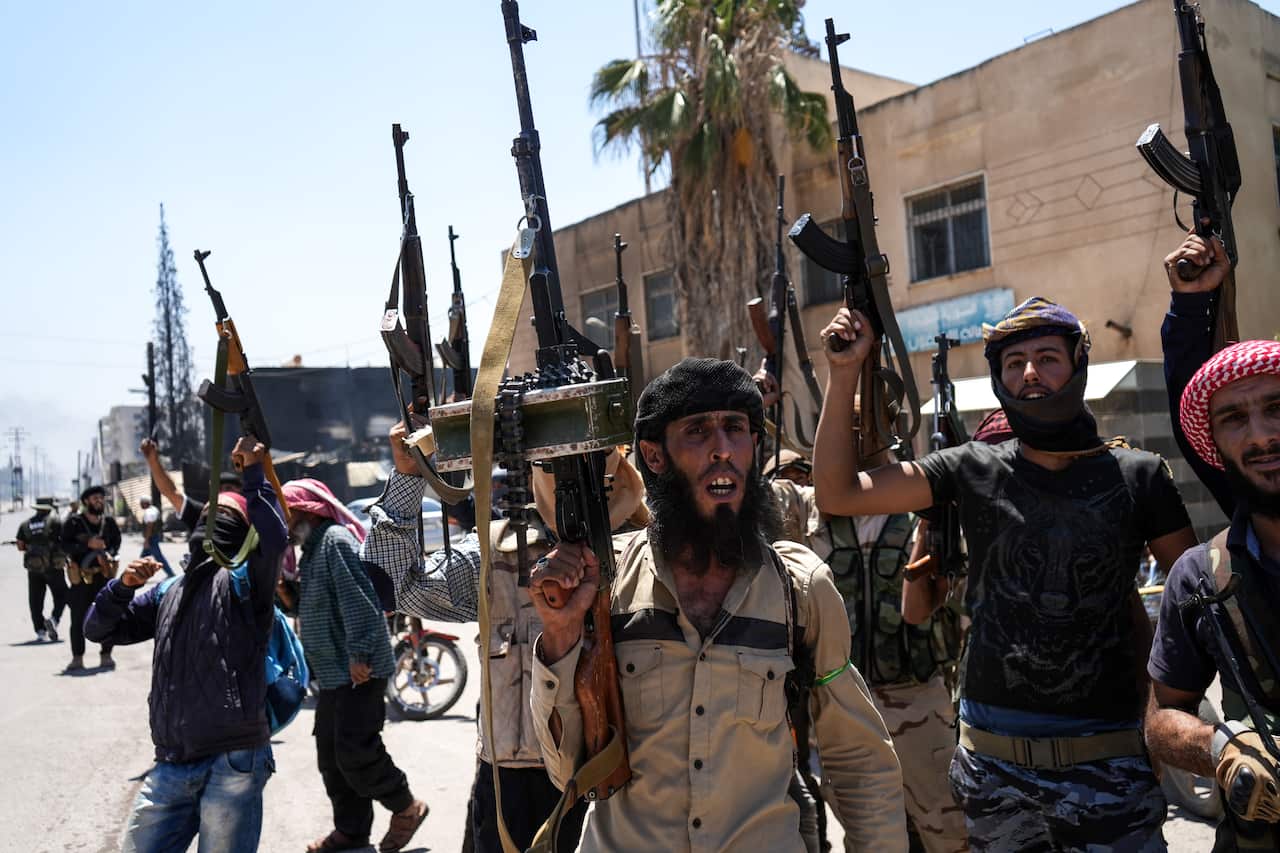 Fighters from Bedouin tribes deploy in the Druze-majority town of Mazra'a