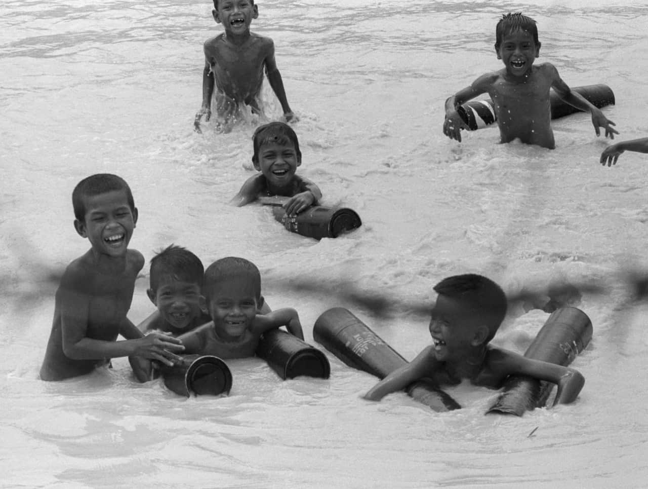 Cambodian Boys Swimming in the Mekong